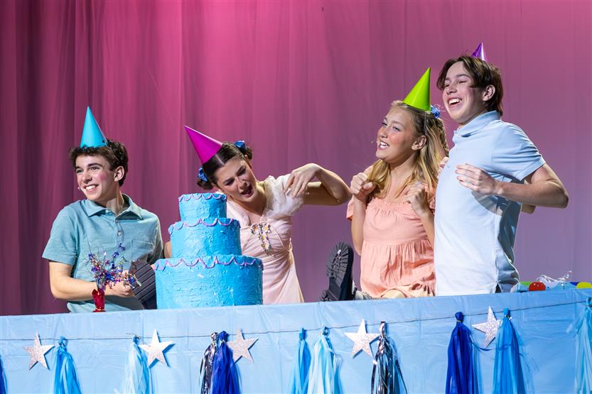 Students perform onstage